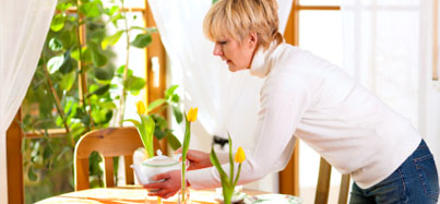 Picture of a woman setting a table